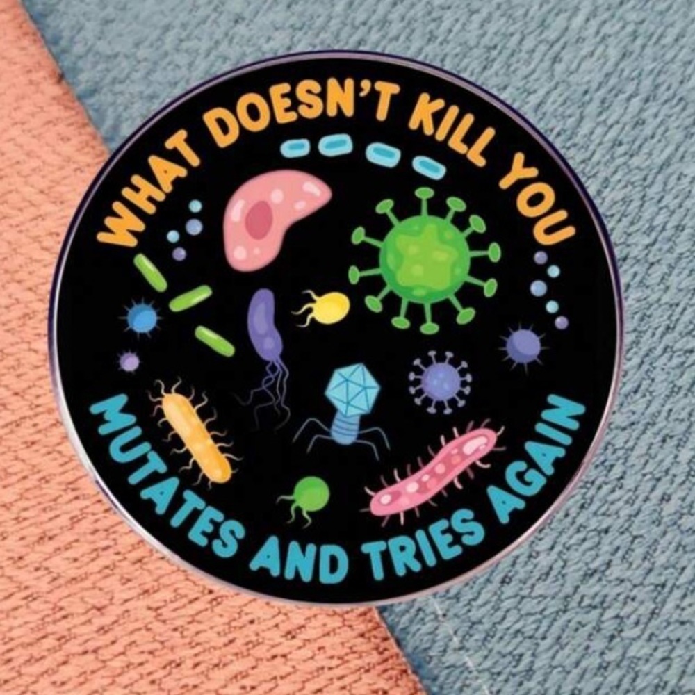Multicolored bacteria What Doesnโt Kill You Mutates and Tries Again enamel pin